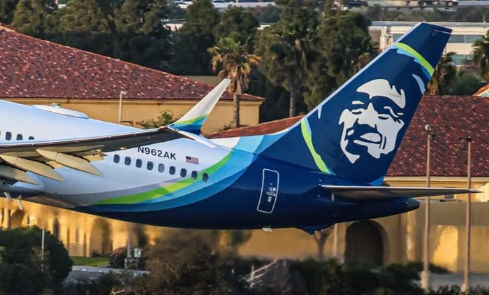 Emergency response vehicles surround Alaska Airlines Boeing 787-9 after landing