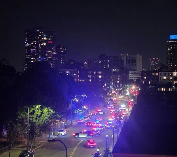 Emergency vehicles and police secure the Seattle Center after reports of gunfire near the Space Needle.