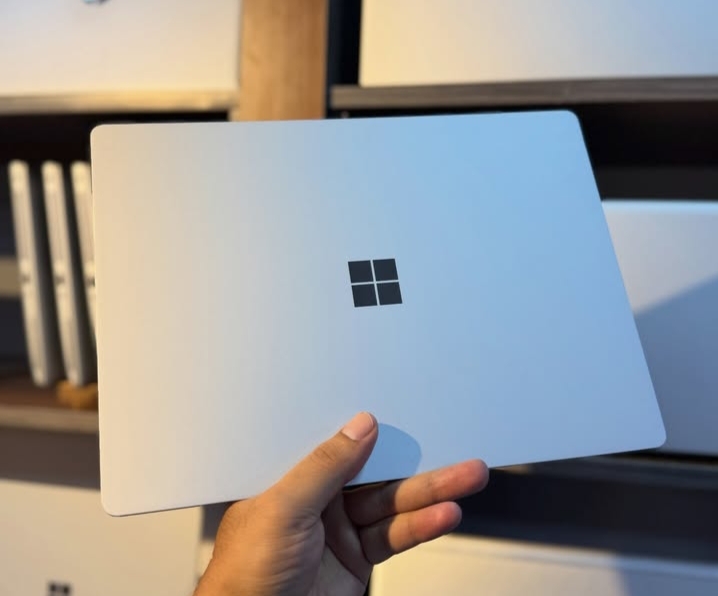 Microsoft logo with stock market chart after strong quarterly earnings.