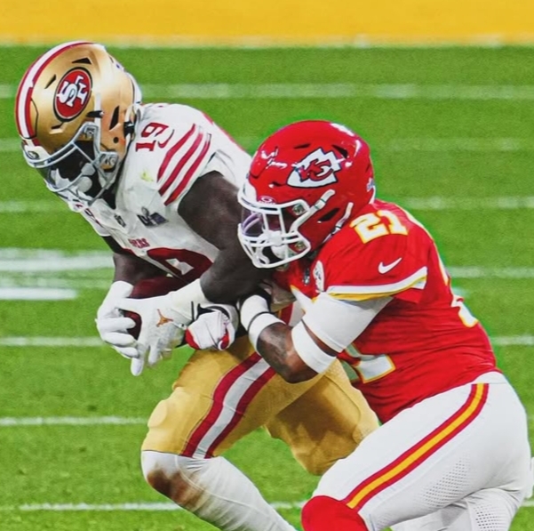Deebo Samuel wearing San Francisco 49ers colors at team facility