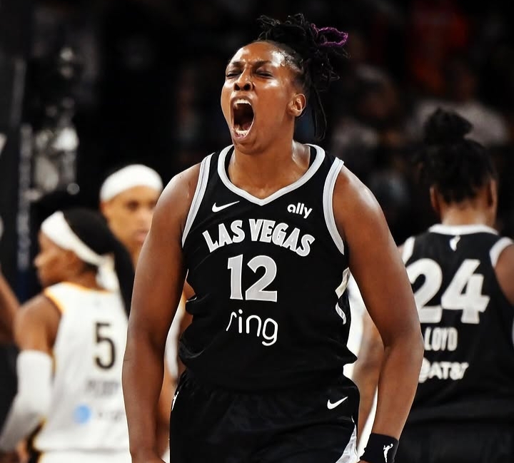 Las Vegas Aces celebrating a crucial late-game basket against the Indiana Fever.
